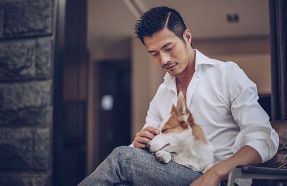 Young Asian male with pet